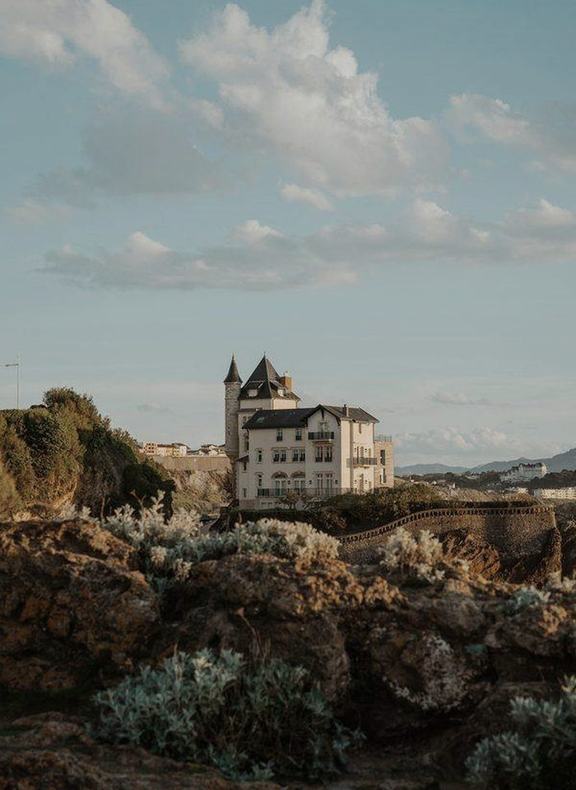 A turreted villa on the rocks above the sea at Biarritz