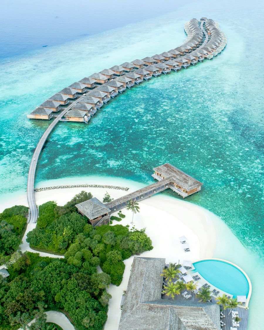 Overwater villas above a turquoise lagoon in the Maldives