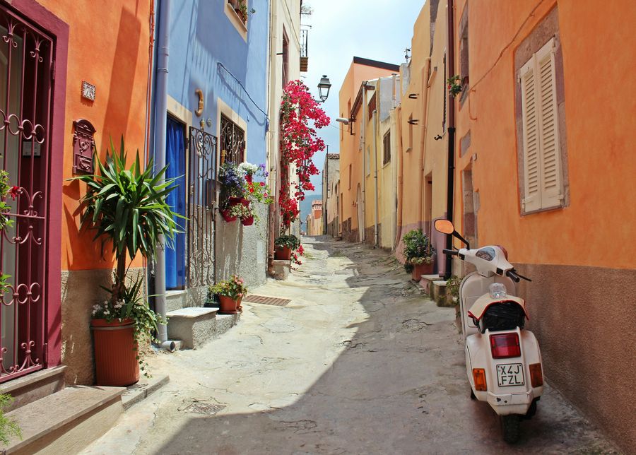 A quiet flower-lined lane in coastal Italy